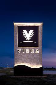 Illuminated Viera, Florida monument sign marking the entrance to one of Brevard County's premier master-planned communities.